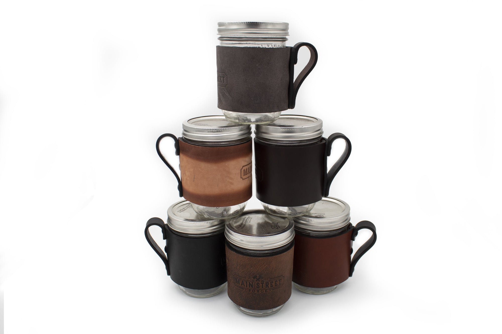 https://mainstreetforge.com/cdn/shop/products/mason-jar-wrap-with-handle-for-hot-cold-drinks-made-in-usa-with-lifetime-warranty-main-street-forge-small-goods-19672094081183_2000x.jpg?v=1602680977